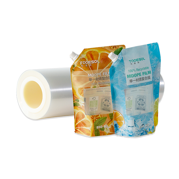 Transparent film roll and two orange and blue Spout Pouches are made of MDOPE, highlighting the 100% recyclable packaging
